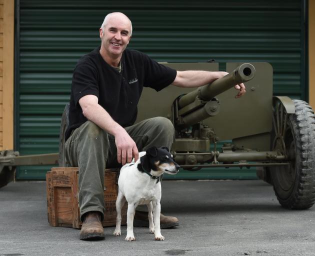 Darryl Brewer with his dog Marvin and anti-tank gun. Photo: Gregor Richardson