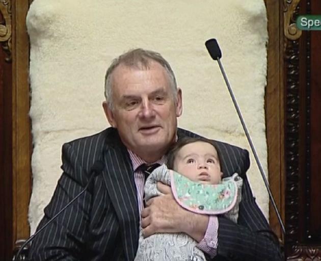 Speaker of the House Trevor Mallard holds MP Willow-Jean Prime's baby Heeni. Photo: NZ Herald