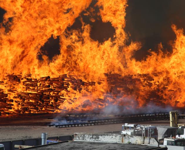 Fire rips through logs. Photo: Chris Derrett/Derrett Photography