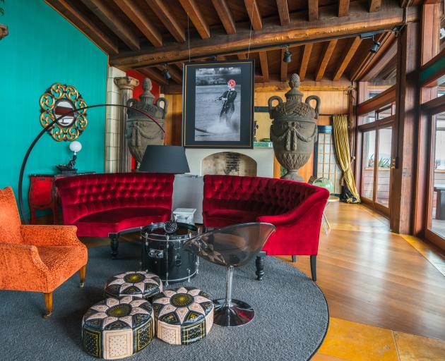 The soaring ceilings and sumptuous, iconoclastic decor in Donkey Bay Inn’s sitting room and bar...