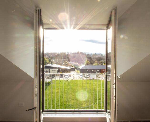 A dormer window in the Rosses’ master bedroom looks on to the shared green space and common house...