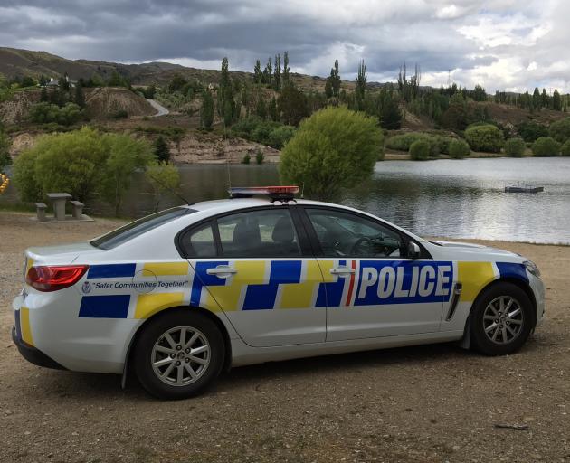 Police at the Bannockburn inlet, the Kawarau arm of Lake Dunstan. Photo: Jono Edwards