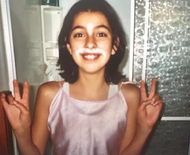 Mava Enoka as a young girl addresses her mo. Photo: RNZ