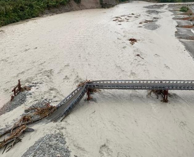 The Waiho River Bridge was washed out after torrential rain. Photo: Wayne Costello / DOC