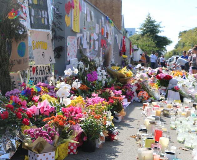 Tributes and flowers left outside Al Noor Mosque in Christchurch after the attacks. Photo: RNZ 