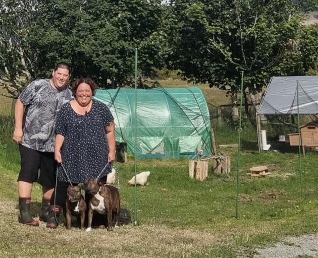 Duncan and Tania Jones are enjoying the farming life in Otautau, with Staffies in front and...