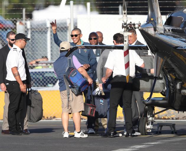 Barack Obama gives a wave before boarding a helicopter bound for Northland. Photo: NZ Herald