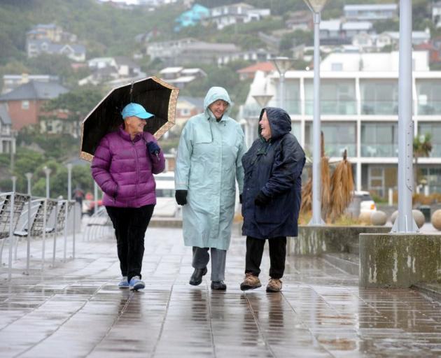 Regular walkers (from left) Marilyn Yates (66), Jo Springett (76) and Kathleen  West (70)  dress for the conditions at St Clair Esplanade, Dunedin, earlier this  week. ‘‘We usually walk for an hour, sometimes longer,’’ Mrs Springett says.  ‘‘W