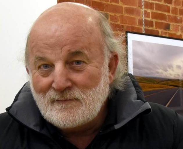 Scotto Clarke ponders his new exhibition at the gallery he owns, Brick Brothers Gallery, in Dunedin. Photo by Craig Baxter