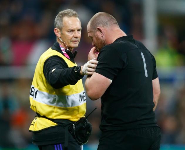 Tony Woodcock of the New Zealand All Blacks walks off the pitch with team doctor Tony Page after suffering an injury during the match against Tonga. Photo by Getty Tony Woodcock of the New Zealand All Blacks walks off the pitch with team doctor Tony Page after suffering an injury during the match against Tonga. Photo by Getty
