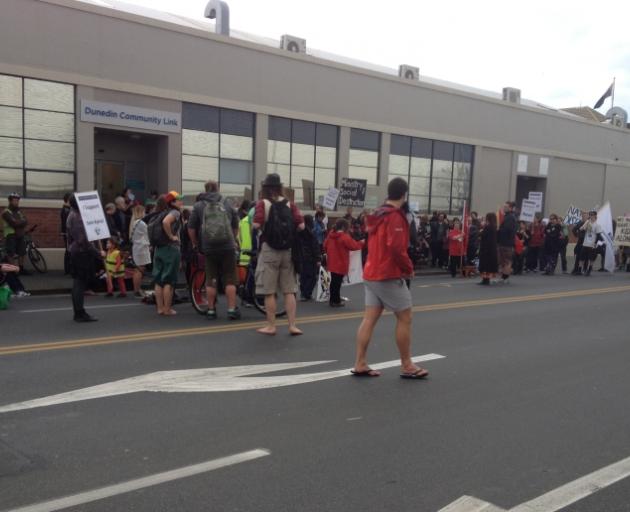 About 150 people gathered outside Work and Income in Dunedin to protest proposed welfare reforms. Photo by Craig Baxter.