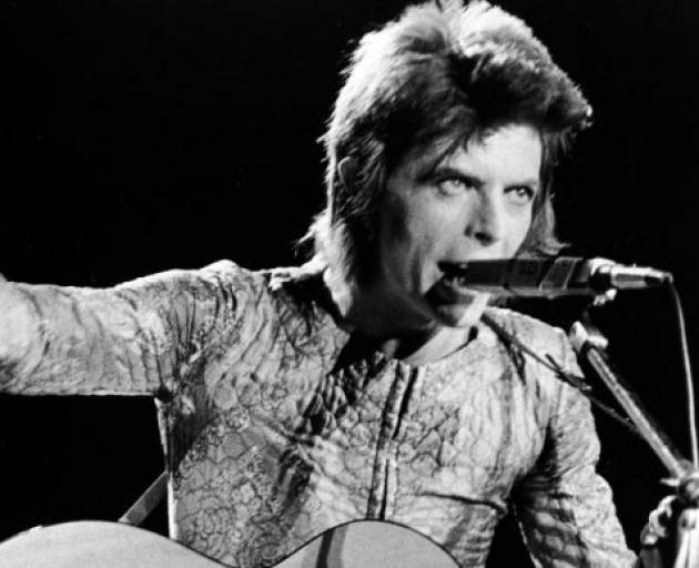 David Bowie on stage as Ziggy Stardust circa 1973. Photo by Getty.