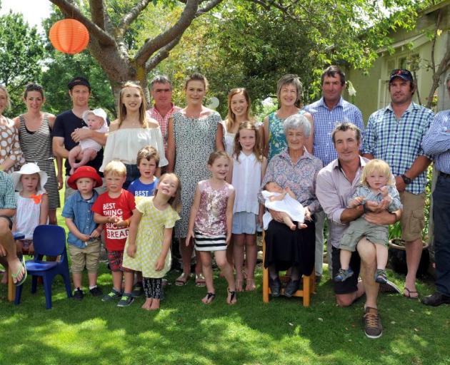 Donella Hore (front, third from right), holding great-granddaughter Esme Hore (seven weeks) is surrounded by her children, grandchildren and great-grandchildren during a celebration yesterday (back from left) Jane Thomson, Anna Hore, Sam Hore (holding bab