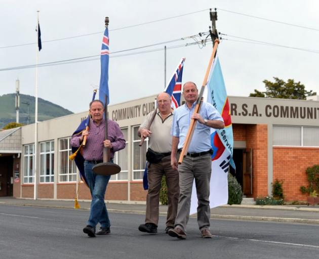 Moving memorabilia out of the Mosgiel RSA yesterday are (from left) manager Peter Moore, president Noel Graham and vice-president Tony Mobbs.  Photo by Stephen Jaquiery.