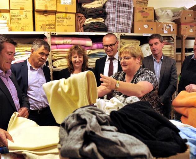 Being shown donations for refugees by Red Cross southern humanitarian services manager Sue Price (centre) are (from left) National MP Michael Woodhouse, Mayor Dave Cull, Labour MPs Clare Curran and David Clark, Mercy Hospital chief executive and Red Cross