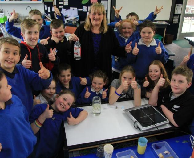 Ruth Baldwin demonstrates ''dancing popcorn'' for her year 4, 5, and 6 class at Kaitangata School yesterday. PHOTO: HAMISH MACLEAN Ruth Baldwin demonstrates ''dancing popcorn'' for her year 4, 5, and 6 class at Kaitangata School yesterday. PHOTO: HAMISH MACLEAN