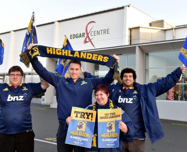 Highlander Ben Smith (second from left) joins fans (from left) Keegan Branks, Jean-Anne Branks and Samy Abouifaouz yesterday in the call for flags to be returned to the Edgar Centre in Dunedin. Photo by Gregor Richardson. 