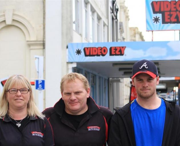 Andrea, Shane (centre) and Josh Buchan are walking away from Oamaru's Video Ezy store. PHOTO: HAMISH MACLEAN