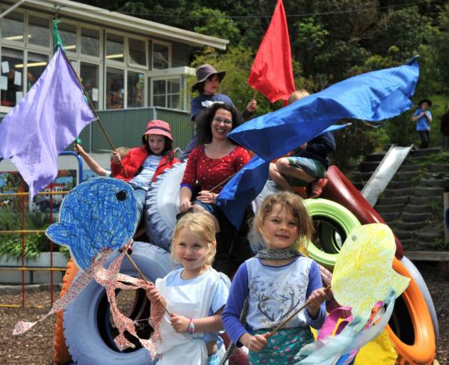 Waving creations at St Leonard's School yesterday  are West Harbour Arts Week artist-in-residence Jessica Latton and pupils (clockwise from bottom left) Valla Wilkinson (6), Isabella Davey (7), Billy Geels (6) and Pearl Daniel (6). Photo by Gregor Richard