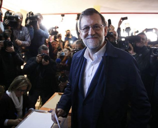 Prime Minister Mariano Rajoy casts his vote. Photo: Reuters 