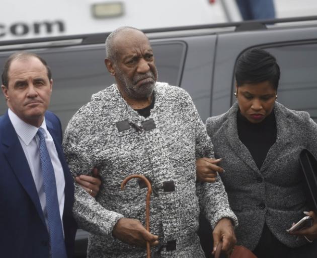 Bill Cosby (centre) arrives at the courthouse in Pennsylvania. Photo: Reuters
