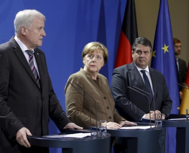 Chancellor Angela Merkel (centre) Economy Minister Sigmar Gabriel (right) and Bavarian State Premier Horst Seehofer. Photo: Reuters 