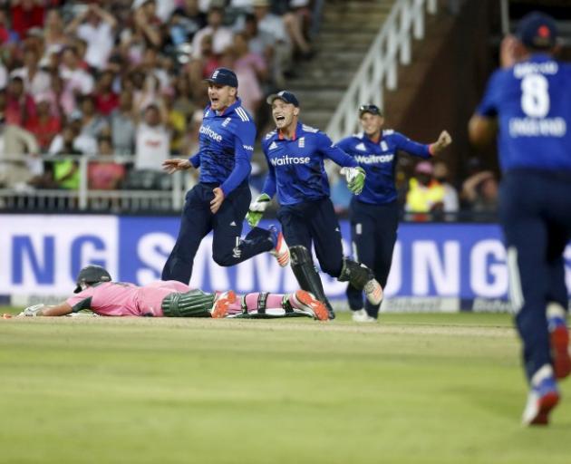 England players celebrate as South Africa's AB de Villiers is run out. Photo: Reuters 