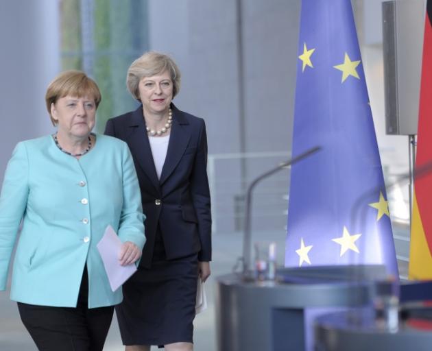 Angela Merkel (left) and Theresa May in Berlin. Photo: Reuters