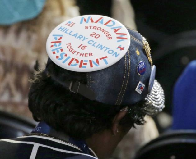 A delegate wears a Hillary Clinton button on their hat at the Democratic National Convention in Philadelphia.  Photo: Reuters 