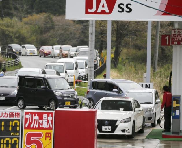 Cars waiting to refuel at a petrol station after a series of earthquakes in Aso, Kumamoto prefecture, in southern Japan. Photo: Reuters/Kyodo 