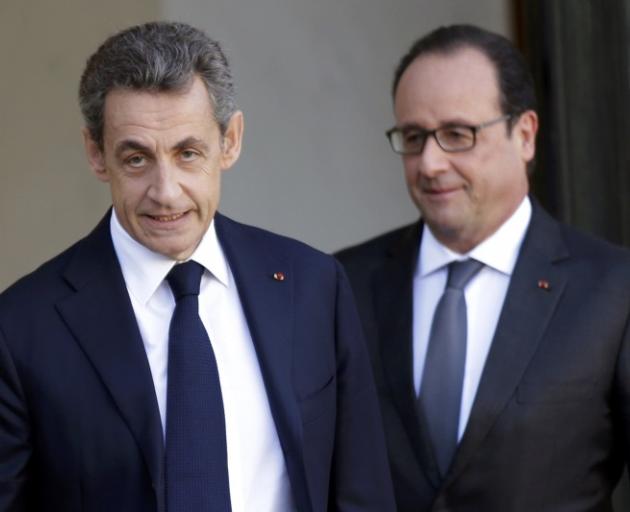 Nicolas Sarkozy (left) and Francois Hollande - united front against Paris terror attcks.  Photo: Reuters 