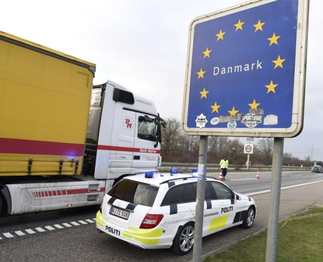 A policeman watches the traffic at a checkpoint on the German-Danish border crossing in Froslev. Photo: Reuters A policeman watches the traffic at a checkpoint on the German-Danish border crossing in Froslev. Photo: Reuters