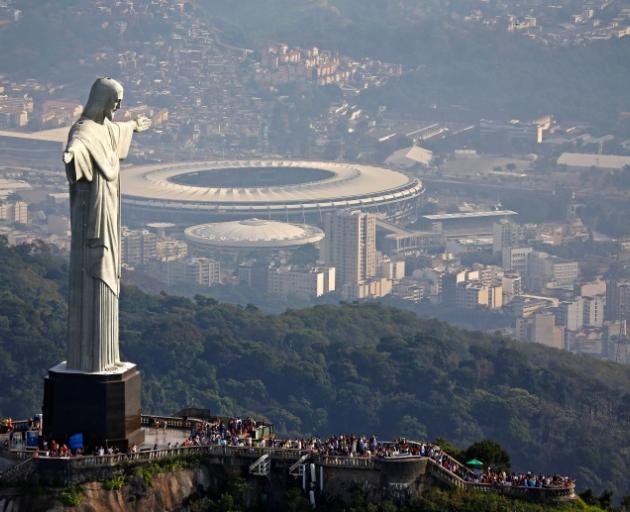 The giant statue Christ the Redeemer overlooks the Olympic stadium in Rio de Janeiro. Photo: Reuters