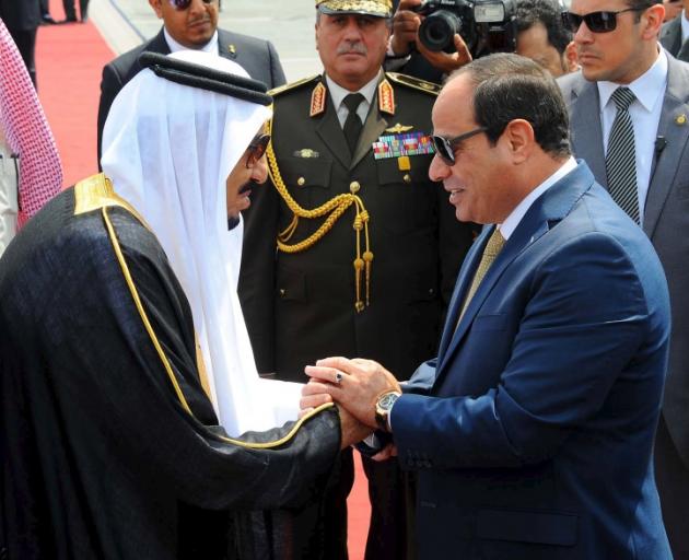 King Salman of Saudi Arabia (left) is greeted by Egyptian President Abdel Fattah al-Sisi. Photo: Reuters 