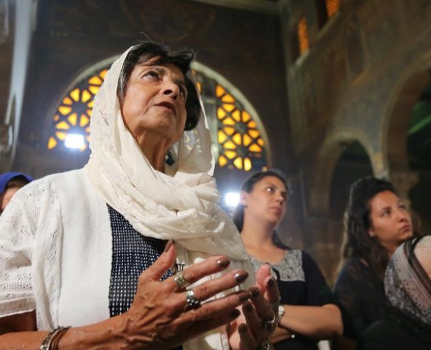 Relatives of the Christian victims of the crashed EgyptAir plane attend an absentee funeral mass at the main Cathedral in Cairo on Sunday. Photo: Reuters 