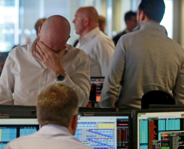 Workers at BGC, a global brokerage company in London, during trading on Friday. Photo: Reuters 