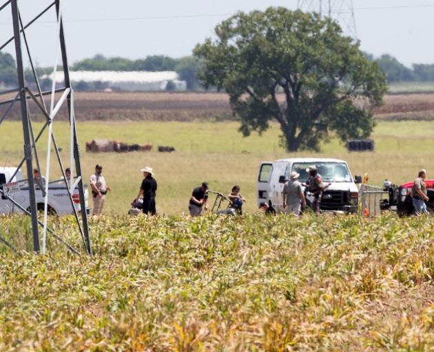 The frame of the balloon is seen in a crop field in Maxwell, Texas, on Saturday. Photo: Reuters 