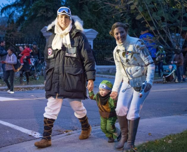 Canadian Prime Minister-designate Justin Trudeau, dressed as Han Solo, and his wife Sophie Gregoire with their son Hadrien, while trick-or-treating on Halloween. Photo: Reuters