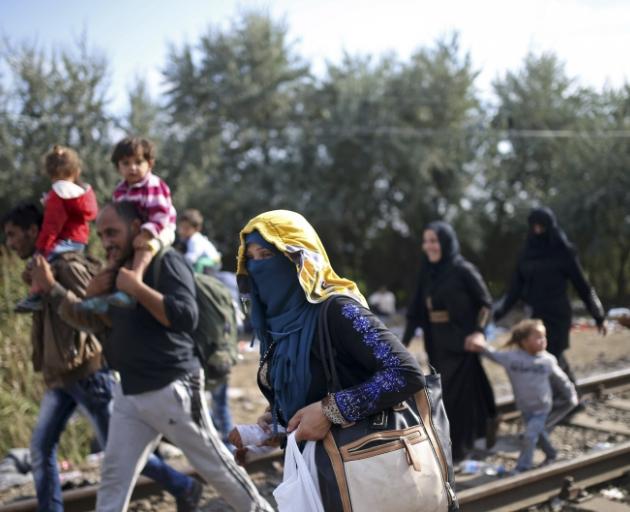  Migrants making the trek from Serbia at the border near Roszke in Hungary. Photo: Reuters