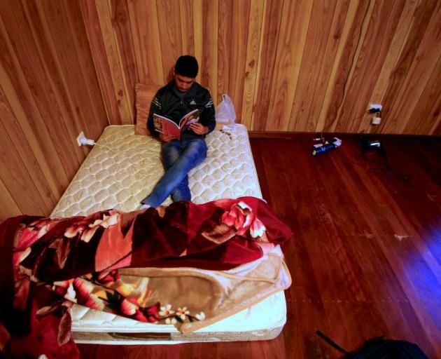 Ali Rasooli, a refugee from Afghanistan, at a house he rents with others in the western Sydney. Photo: Reuters