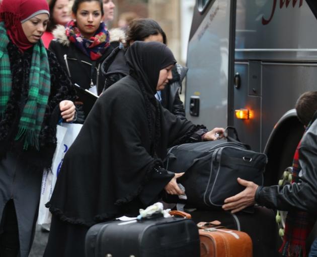 Syrian refugees arriving in Scotland last year. Photo: Getty Images Syrian refugees arriving in Scotland last year. Photo: Getty Images