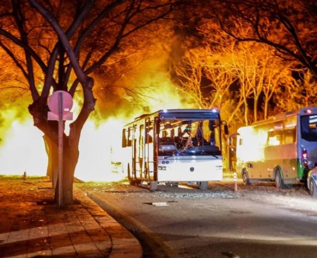 Turkish army service buses burn after the explosion in Ankara. Photo: Getty Images 