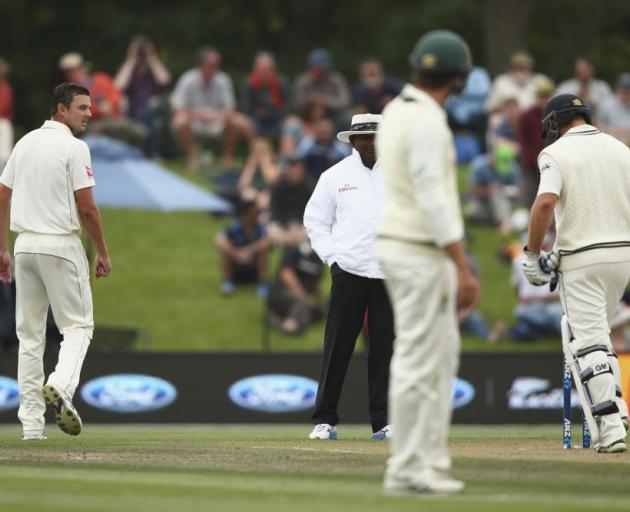 Josh Hazlewood (lsft) has words with batsman Corey Anderson on Tuesday. Photo: Getty Images 