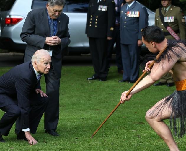 Joe Biden (left) accepts a challenge from Karl Manuel. Photo: Getty Images 