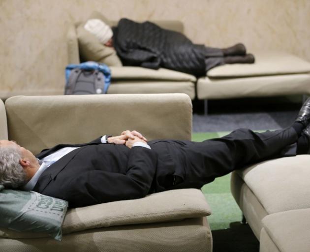 Participants take a break during the climate conference. Photo: Reuters