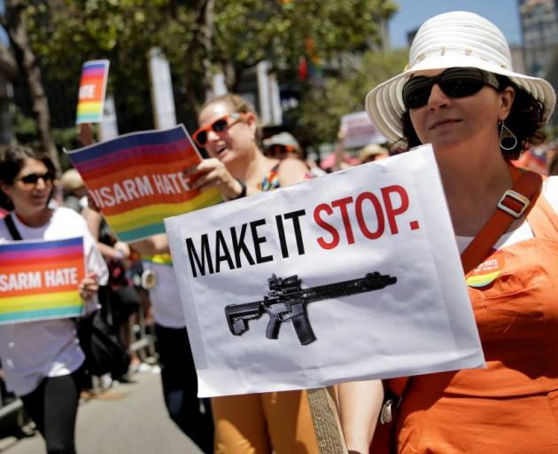 A woman marches in a rally calling for more sensible gun rules at the weekend. Photo: Reuters 