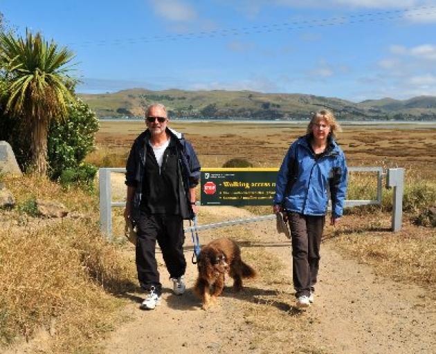 Visiting Aramoana salt marsh with their dog Molly are David and Gillian Elliot, of Port Chalmers, who support the installation of the gate to keep people from taking their vehicles on the marsh. Photo by Christine O'Connor