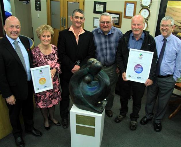 Celebrating after the West Otago Health Trust won  the Supreme Award of the 2015 Trustpower Clutha Community Awards on Tuesday night are (from left) Clutha Mayor Bryan Cadogan, West Otago Health Ltd chairman Marianne Parks, West Otago Health Trust chairma