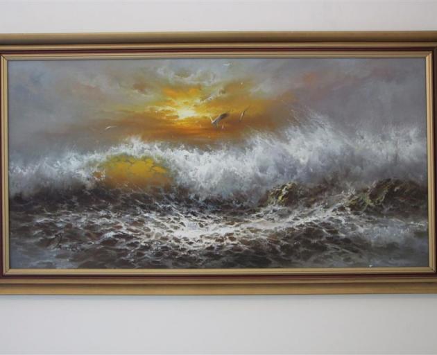 A beautiful and skilfully executed stormy sunset seascape oil painting, the provenance of which is unclear. Photo: Bruce Munro