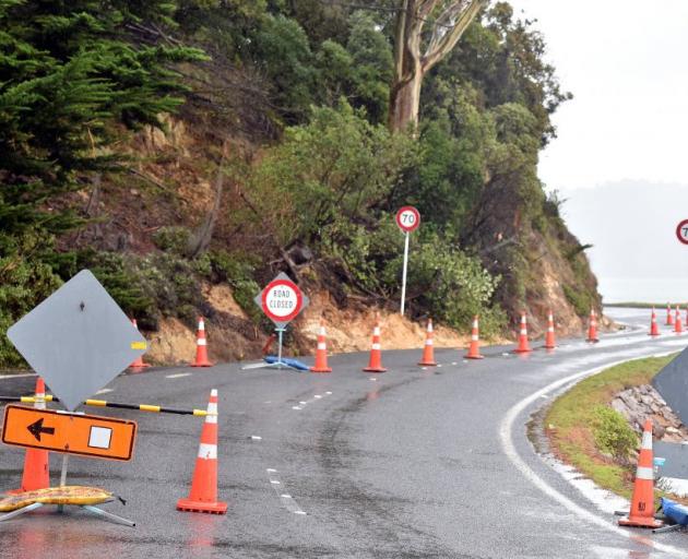 A slip closed a section of Portobello Rd between Beaconsfield Rd and Seaton Rd near Edwards Bay, yesterday. PHOTO: GREGOR RICHARDSON